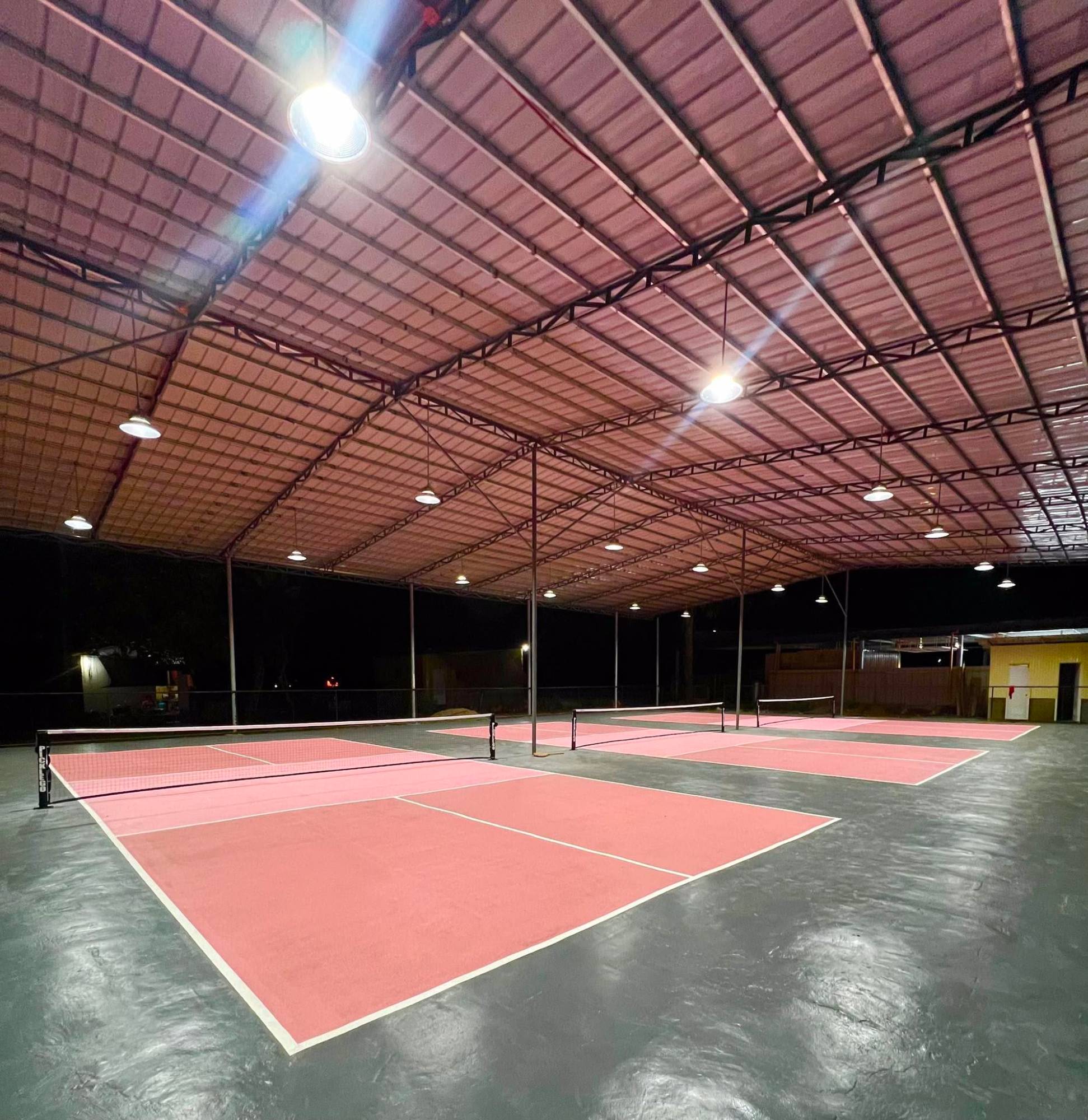 PickleGo covered courts at night